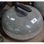 An Antique granite curling stone with brass and eb