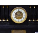 A Victorian slate cased architectural mantel clock