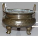 A Chinese bronze censer with inlaid silver wire de