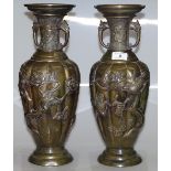 A pair of Chinese relief cast-bronze vases with ex
