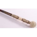 A 19th century walking cane with carved ivory hand