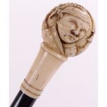 A Chinese carved ivory-handled walking cane, circa