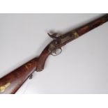 An Antique percussion rifle