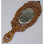 A Sorento ware hand mirror with pierced surround