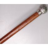 A Victorian embossed silver-topped walking cane