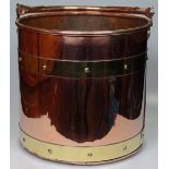 A copper and brass coal bucket