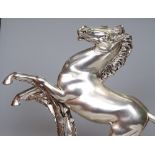 A signed silvered figure of a horse on plinth by G