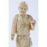 A Japanese Meiji period ivory okimono, depicting a