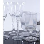 A set of 4 funnel shaped wine glasses with twist s