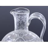 A Victorian glass claret jug with finely engraved