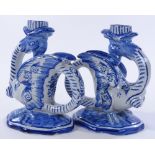 A pair of Delft Pottery dragon design candle holde