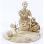 A Japanese Meiji period ivory tableau, depicting a