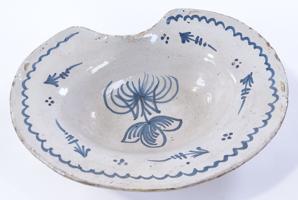 A tin-glazed pottery barber's bowl, with painted b