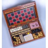 A Victorian mahogany games compendium, the interio