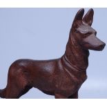 A patinated cast-iron figure of a German Shepherd