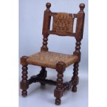 A Victorian walnut doll's chair with rush seat, he