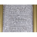 An Oriental relief embossed silver plaque, depicti