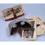 A Victorian stereoscopic card viewer and cards