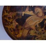 A Japanese tortoiseshell and gold lacquer relief b