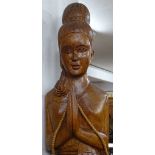 A large Oriental carved hardwood standing figure,