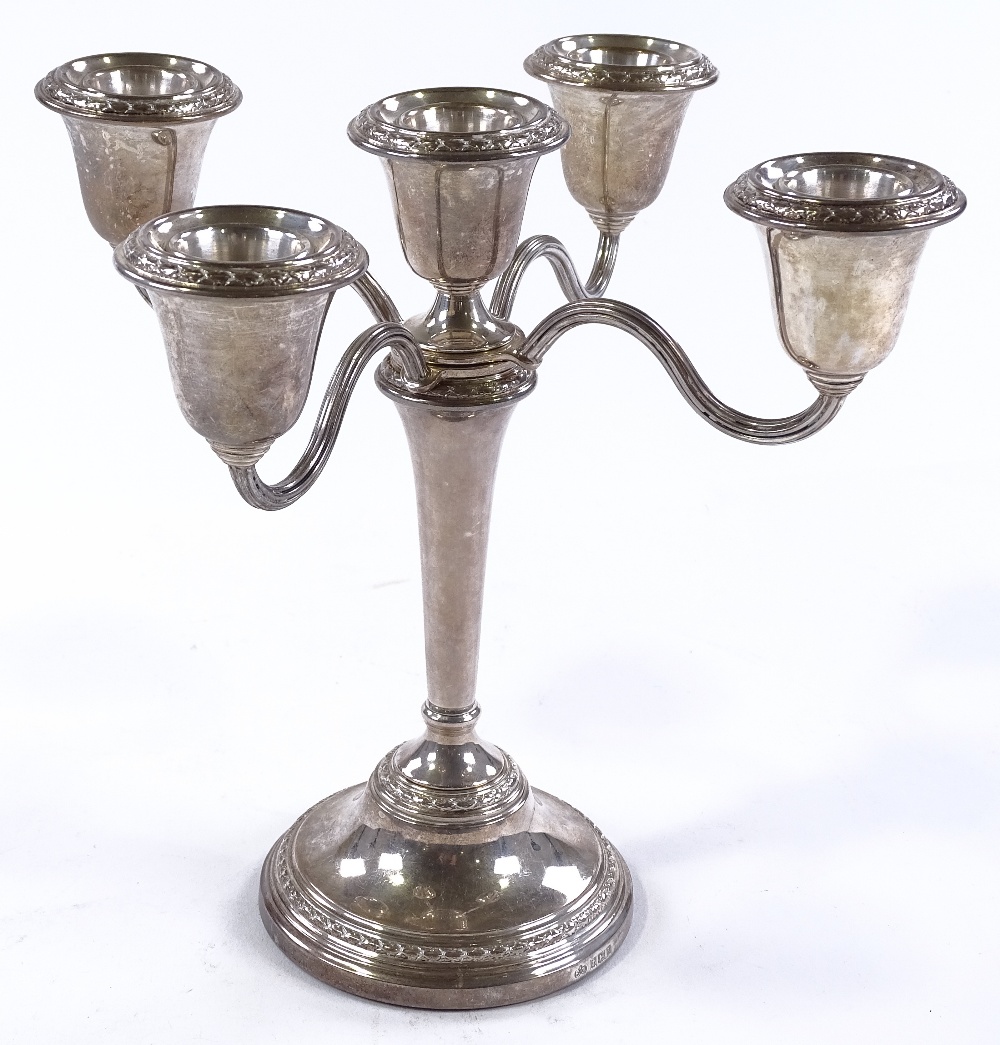 An Elkington & Co silver inter-changeable candelab