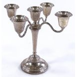 An Elkington & Co silver inter-changeable candelab