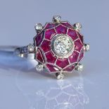 An Art Deco style ruby and diamond cluster spider