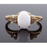 An 18ct gold cabochon opal and diamond dress ring,