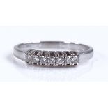 An 18ct white gold 7-stone diamond ring, total dia