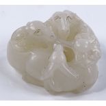 A Chinese white jade carving in the form of 3 rams