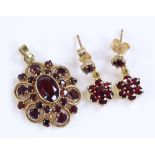 A 14ct gold garnet set pendant and earring set (2)