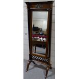 A reproduction mahogany cheval mirror, with ebonis