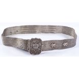 A Middle Eastern white metal belt, with crown and