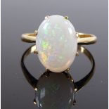 An unmarked gold cabochon opal ring, setting heigh