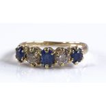 An 18ct gold 5-stone sapphire and diamond ring, se