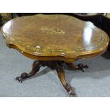 A walnut and marquetry inlaid centre table, on car