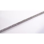 An 18ct white gold diamond tennis line bracelet, t