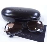 Gucci Italy, a pair of sunglasses in original case