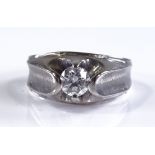 An unmarked white gold solitaire diamond gypsy rin