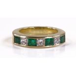 An 18ct gold emerald and diamond half hoop ring, s