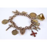 A 9ct gold curb link heart-lock charm bracelet, se