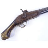 A reproduction brass-mounted percussion pistol