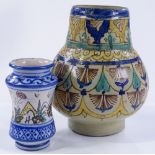 A Middle Eastern pottery vase with hand painted de