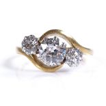 An 18ct gold 3 stone diamond ring, asymmetric cros