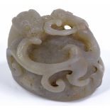 A Chinese carved and pierced jade dragon ornament,