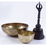 2 Tibetan bronze singing bowls, largest 13cm diame