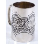 A late Victorian silver mug, with relief embossed