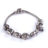 A silver Pandora bracelet, with 7 silver charms, 3