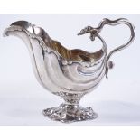 A large Victorian nautilus-shaped silver cream jug