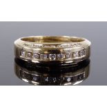 A 9ct gold diamond set ring with diamond bridge, c